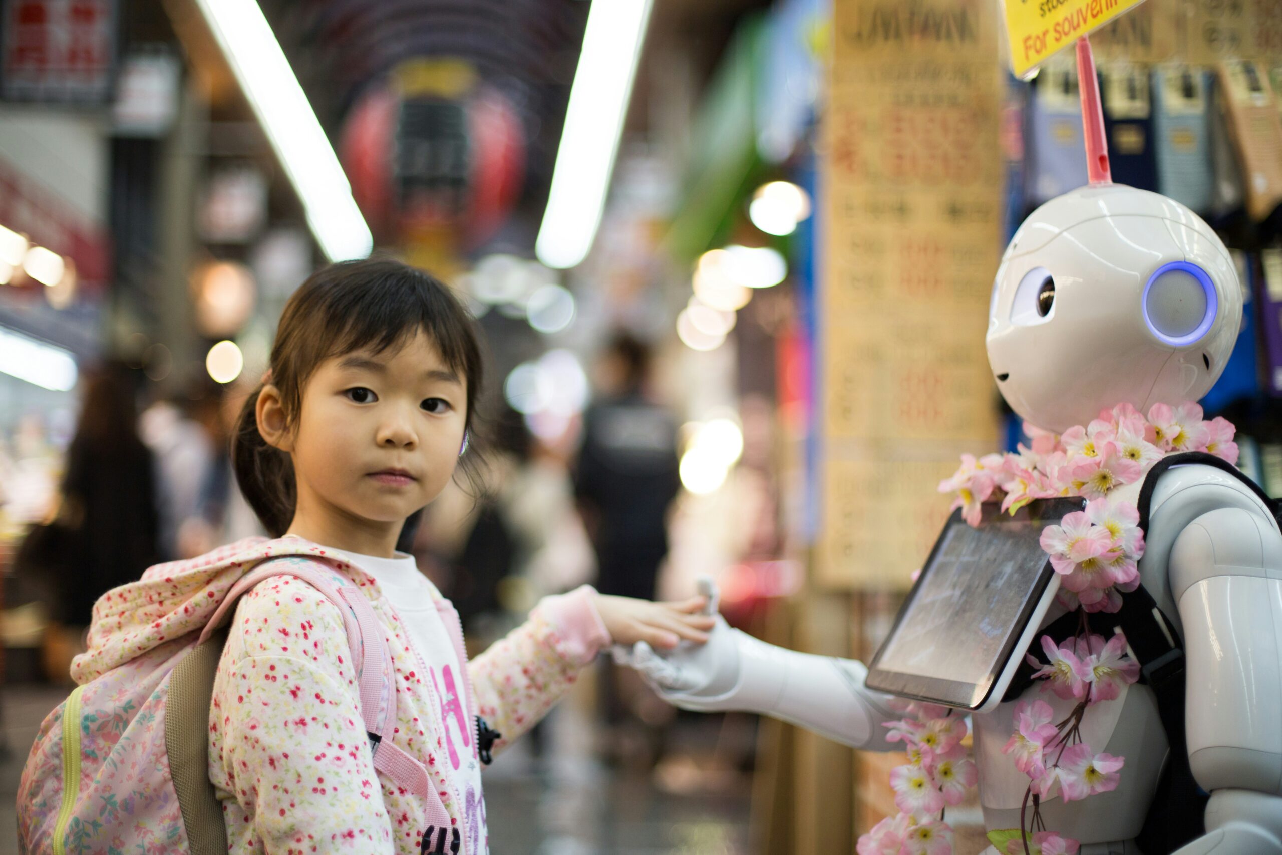 The Rise of AI in Business: Transforming Industries and Driving Innovation 7 photo of girl laying left hand on white digital robot